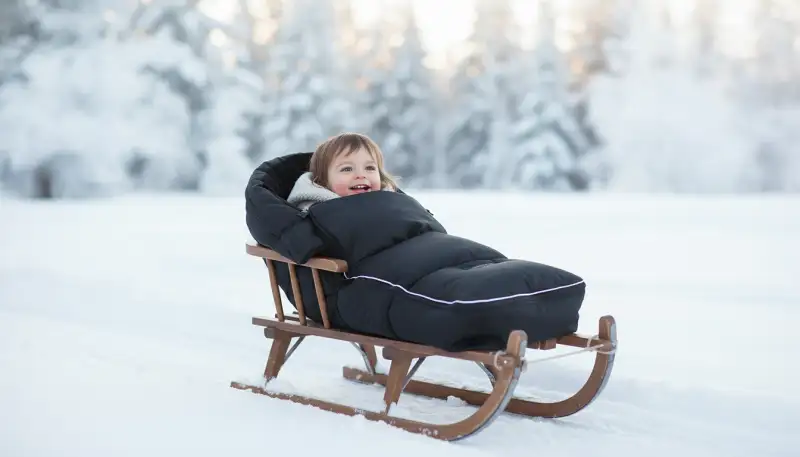 Optimaler Schlittenfußsack: Warm durch den Winter